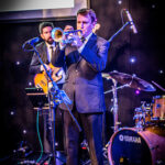 Live swing soul and Motown function band The Get Downs Lite performing at a charity ball in Brighton